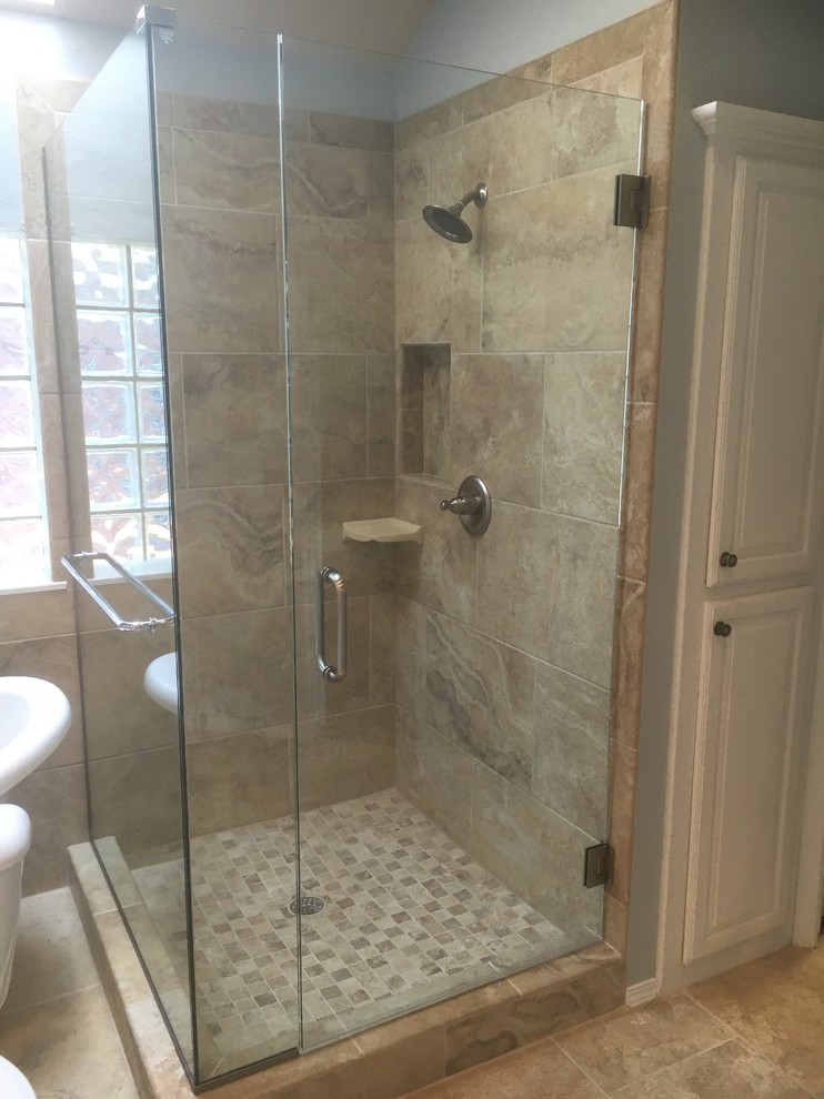Photo of a large classic ensuite bathroom in Oklahoma City with raised-panel cabinets, white cabinets, a claw-foot bath, a corner shower, beige tiles, stone tiles, blue walls, limestone flooring, a submerged sink and granite worktops.