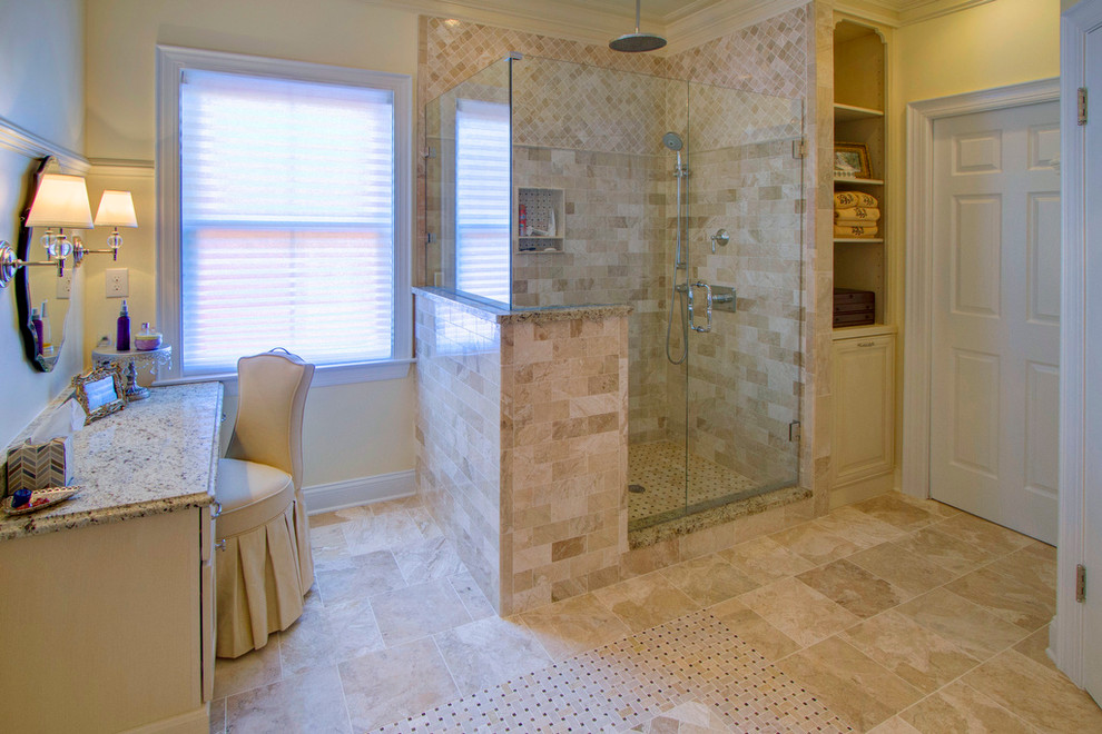 Large classic ensuite bathroom in Charlotte with a corner shower, beige tiles and marble flooring.