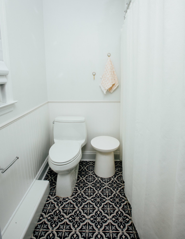 Design ideas for a small contemporary cloakroom in New York with glass-front cabinets, white cabinets, a one-piece toilet, white tiles, ceramic tiles, white walls, mosaic tile flooring, a built-in sink, quartz worktops and blue floors.