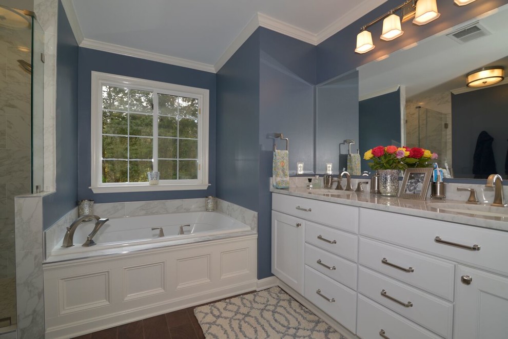 Bathroom - mid-sized transitional master gray tile and stone slab dark wood floor bathroom idea in DC Metro with shaker cabinets, white cabinets, blue walls, an undermount sink and marble countertops