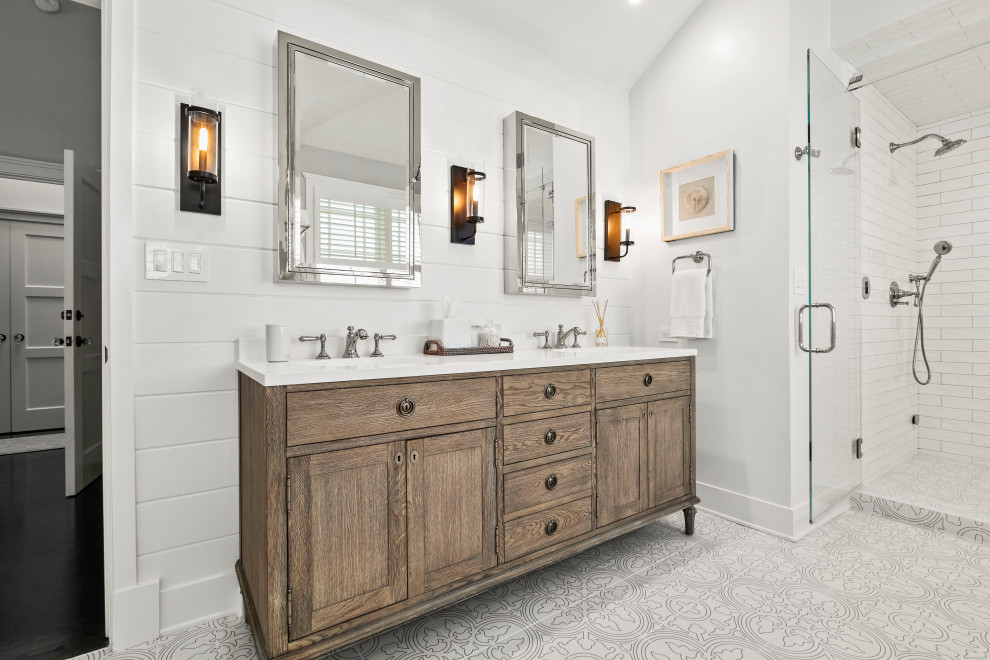 Photo of a large traditional ensuite wet room bathroom in Los Angeles with freestanding cabinets, distressed cabinets, a freestanding bath, white tiles, metro tiles, white walls, porcelain flooring, multi-coloured floors and white worktops.
