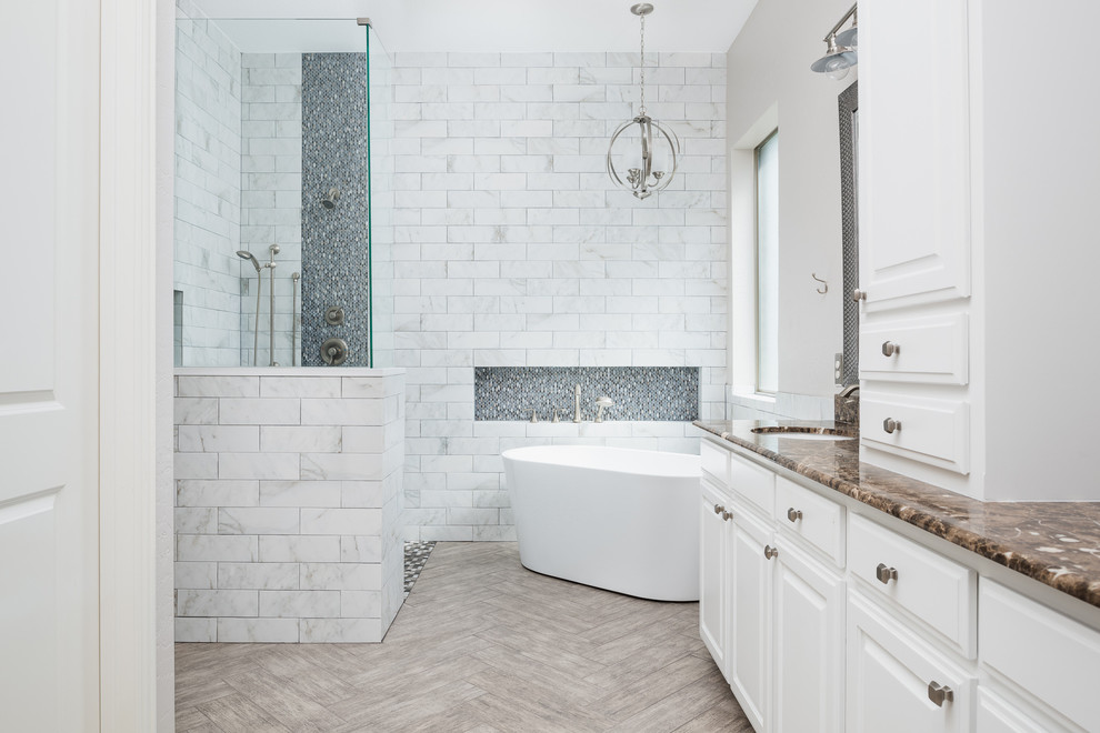 Bathroom - large modern master white tile and marble tile porcelain tile and beige floor bathroom idea in Dallas with shaker cabinets, white cabinets, a one-piece toilet, white walls, an integrated sink and marble countertops