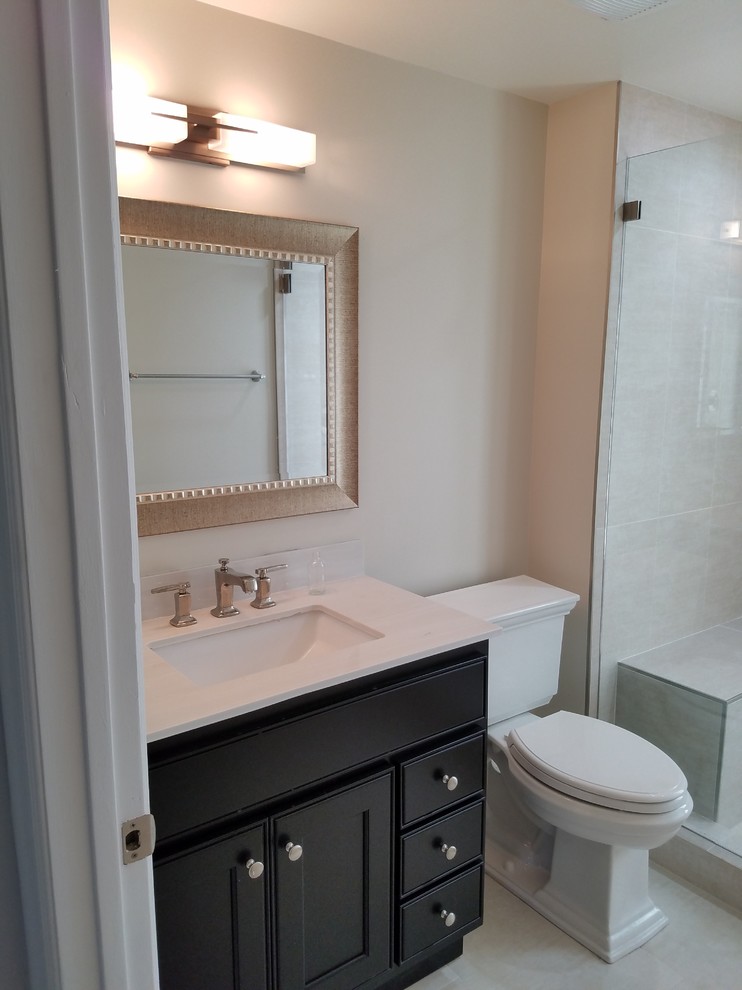 Design ideas for a small classic shower room bathroom in Los Angeles with recessed-panel cabinets, dark wood cabinets, an alcove shower, beige walls, a submerged sink, quartz worktops, beige floors, an open shower, laminate floors, beige tiles and porcelain tiles.