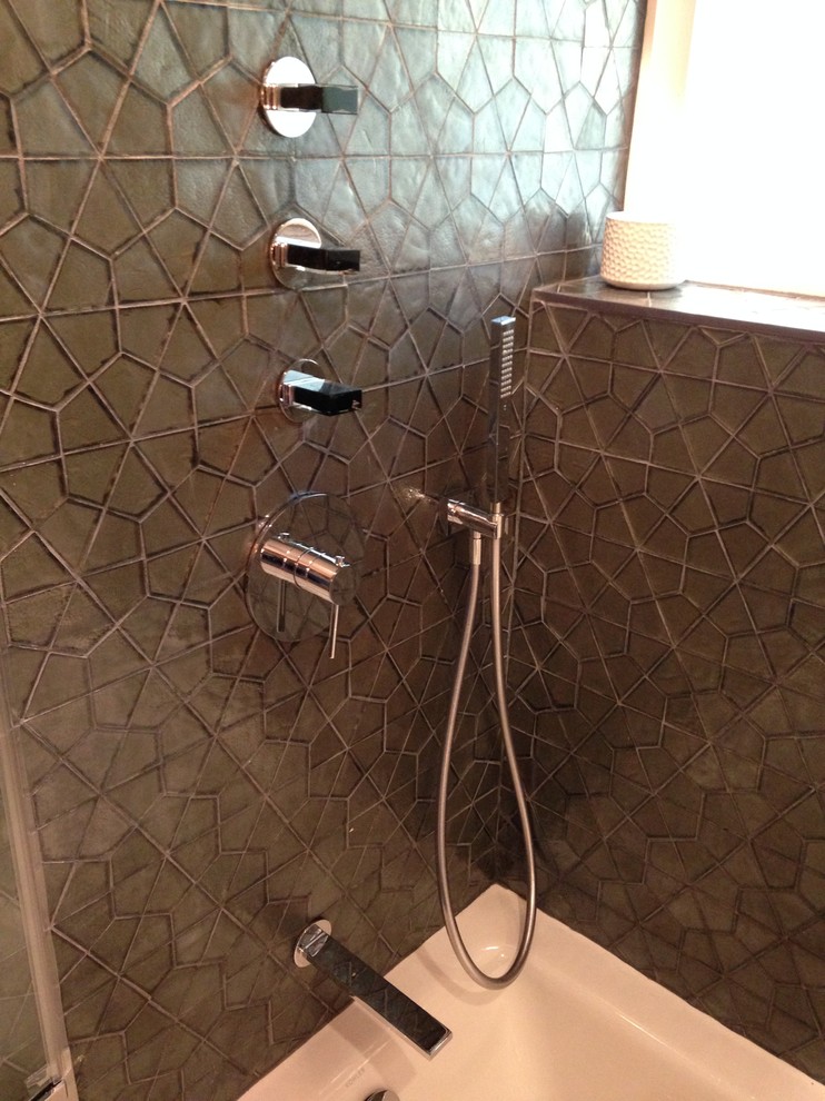 Tub/shower combo - mid-sized modern master black tile, gray tile and mosaic tile porcelain tile tub/shower combo idea in Los Angeles with flat-panel cabinets, dark wood cabinets, white walls, a vessel sink and solid surface countertops