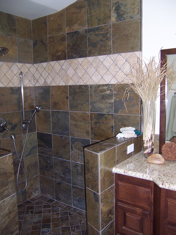 This is an example of a medium sized classic shower room bathroom in Sacramento with raised-panel cabinets, dark wood cabinets, an alcove shower, grey tiles, slate tiles, white walls, slate flooring, a submerged sink, granite worktops, brown floors and an open shower.