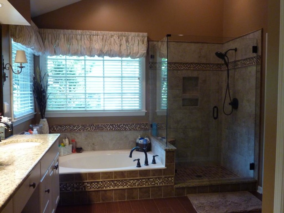Example of a mid-sized classic master beige tile and ceramic tile ceramic tile alcove bathtub design in Charlotte with an undermount sink, raised-panel cabinets, white cabinets, granite countertops and brown walls