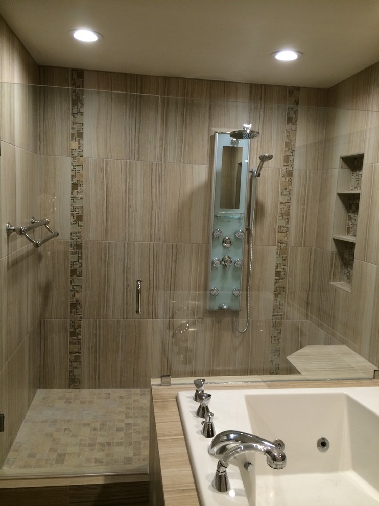 Photo of a large contemporary ensuite bathroom in Dallas with raised-panel cabinets, white cabinets, a walk-in shower, beige tiles, porcelain tiles, grey walls, porcelain flooring, a submerged sink, granite worktops, grey floors, a hinged door and brown worktops.