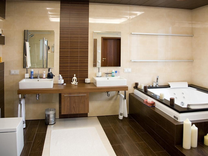 Example of a large trendy master brown tile and porcelain tile porcelain tile, brown floor, double-sink and tray ceiling drop-in bathtub design in San Francisco with shaker cabinets, medium tone wood cabinets, a bidet, beige walls, a vessel sink, wood countertops, beige countertops and a floating vanity