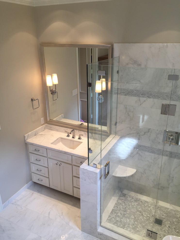 Bathroom - large modern master white tile and stone tile marble floor bathroom idea in Dallas with an undermount sink, shaker cabinets, white cabinets, marble countertops, a one-piece toilet and white walls