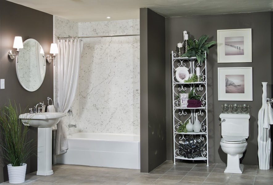 Photo of a medium sized contemporary ensuite bathroom in Wichita with an alcove bath, an alcove shower, a two-piece toilet, grey tiles, ceramic tiles, grey walls, ceramic flooring, a built-in sink and solid surface worktops.