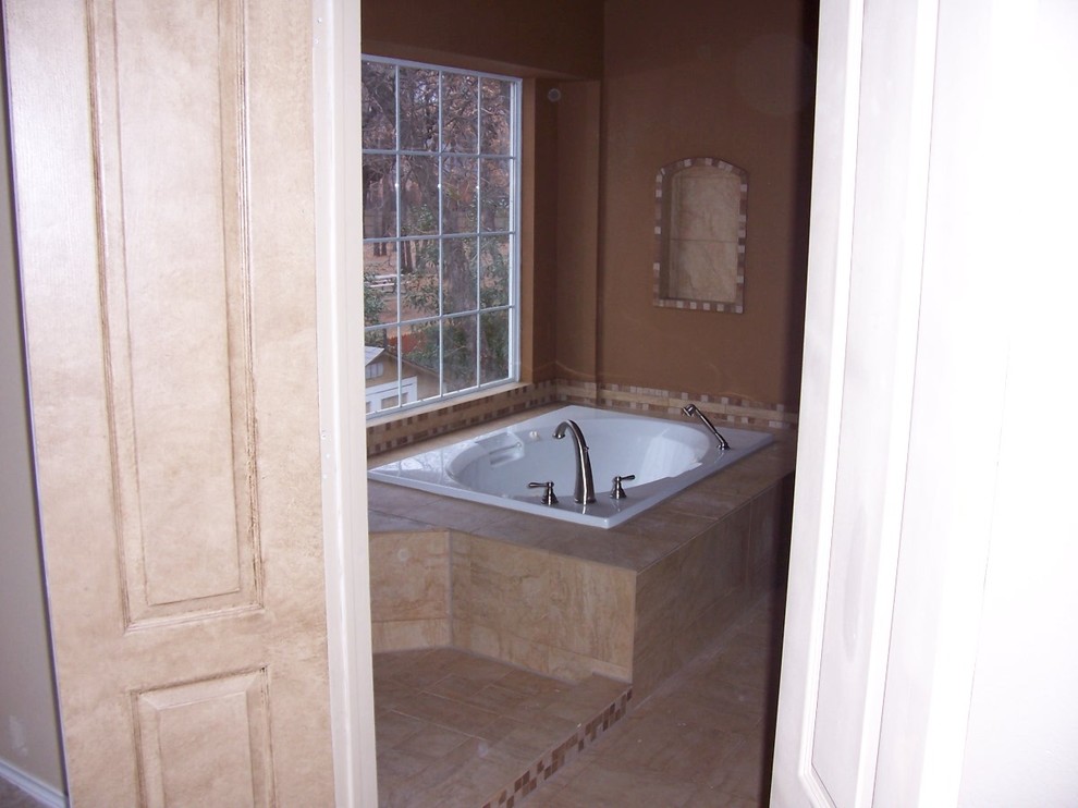 Example of a tuscan bathroom design in Dallas