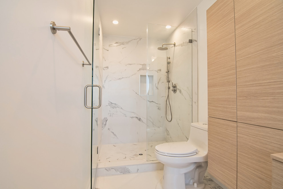 Photo of a medium sized modern ensuite bathroom in Los Angeles with flat-panel cabinets, light wood cabinets, a built-in bath, an alcove shower, a one-piece toilet, white walls, marble flooring, a vessel sink, wooden worktops and a hinged door.