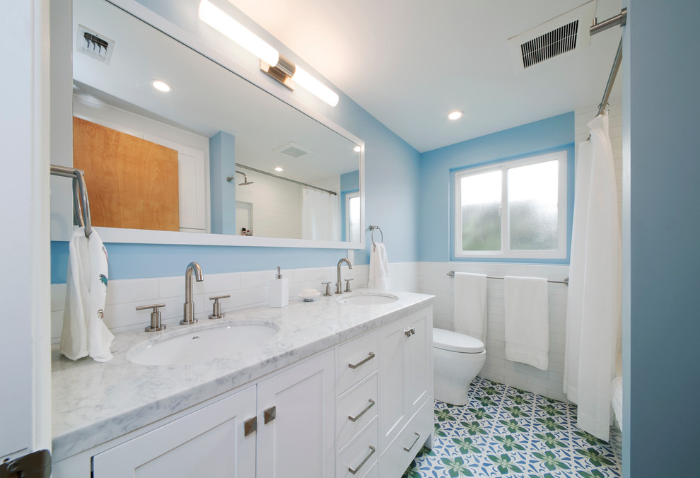 Drop-in bathtub - mid-sized contemporary master multicolored tile and ceramic tile cement tile floor drop-in bathtub idea in Los Angeles with shaker cabinets, blue walls and marble countertops