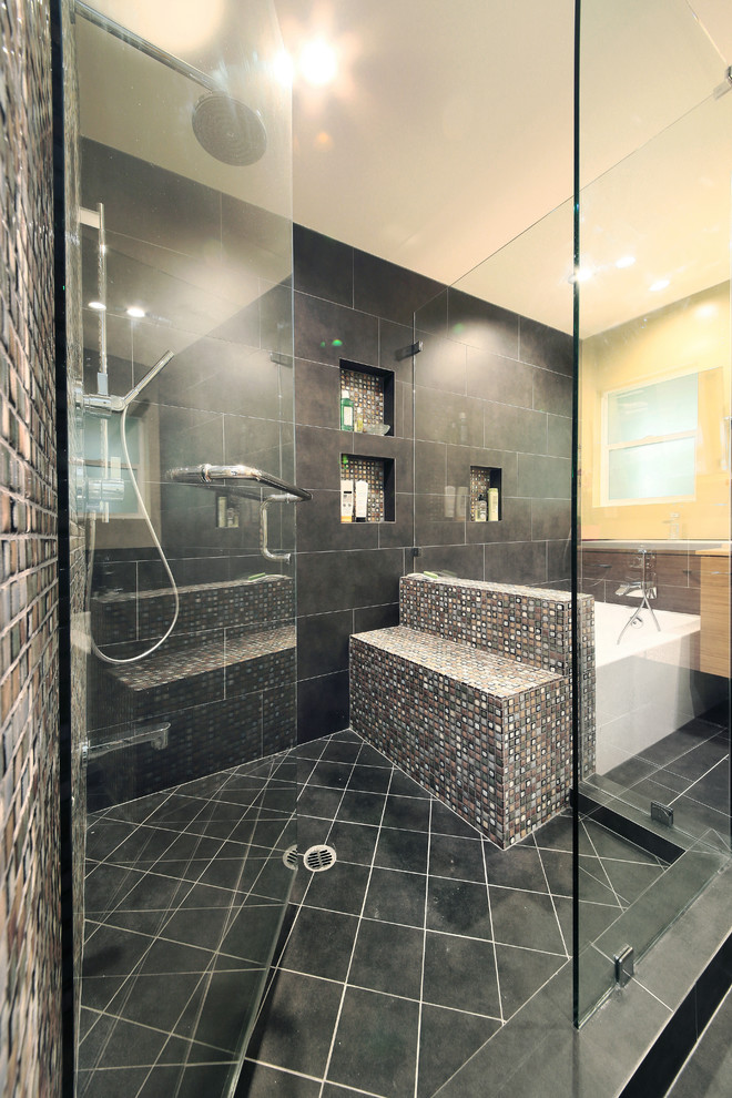 Inspiration for a contemporary master mosaic tile and gray tile ceramic tile double shower remodel in Los Angeles with a vessel sink, flat-panel cabinets, medium tone wood cabinets, wood countertops and a two-piece toilet