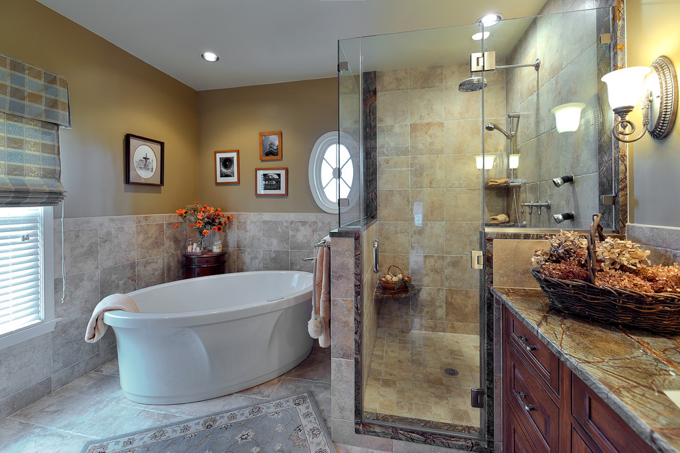 Inspiration for a mid-sized eclectic master multicolored tile and porcelain tile porcelain tile bathroom remodel in Philadelphia with an undermount sink, raised-panel cabinets, dark wood cabinets, marble countertops, a two-piece toilet and brown walls