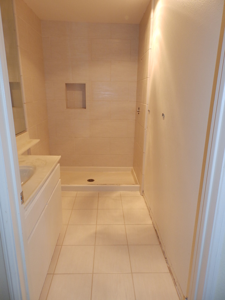 Small contemporary shower room bathroom in Los Angeles with an alcove shower, beige tiles, porcelain tiles and porcelain flooring.