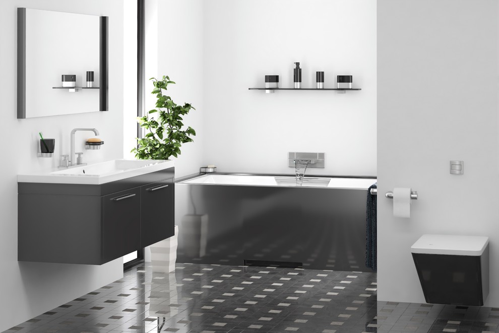 Foto di una stanza da bagno padronale design di medie dimensioni con consolle stile comò, ante nere, vasca sottopiano, WC sospeso, pareti grigie, pavimento con piastrelle in ceramica, lavabo integrato, pavimento nero e top bianco