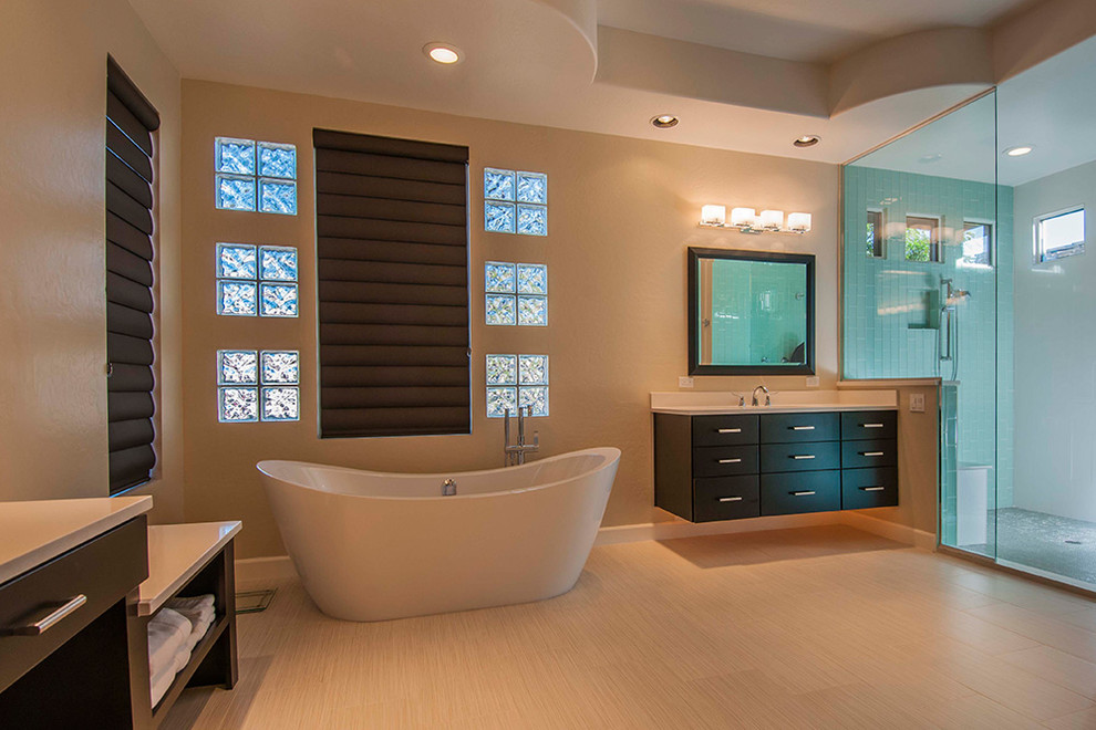 Example of a mid-sized minimalist master beige floor bathroom design in Orlando with beaded inset cabinets, white cabinets, a one-piece toilet, gray walls, an undermount sink and a hinged shower door