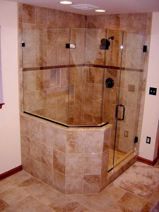 Exemple d'une salle de bain principale en bois brun avec un lavabo encastré, un placard avec porte à panneau surélevé, un plan de toilette en verre, une douche d'angle, un carrelage beige, un mur blanc et un sol en carrelage de céramique.