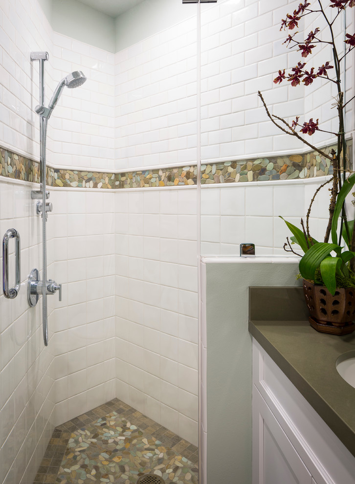 Corner shower - mid-sized transitional 3/4 white tile and ceramic tile porcelain tile corner shower idea in San Francisco with an undermount sink, recessed-panel cabinets, white cabinets, quartz countertops, a two-piece toilet and blue walls