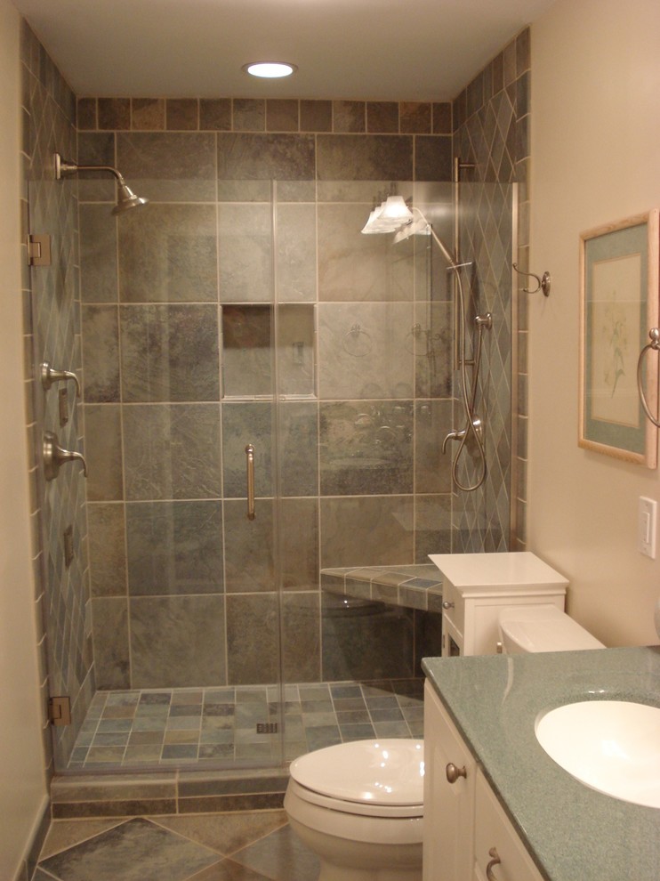 Small modern family bathroom in Chicago with freestanding cabinets, pink tiles, mirror tiles and laminate worktops.
