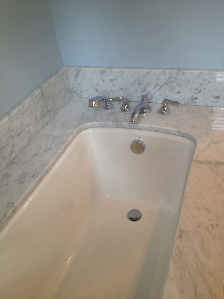 Large transitional master white tile marble floor bathroom photo in Boston with recessed-panel cabinets, white cabinets, a two-piece toilet, blue walls, an undermount sink and marble countertops