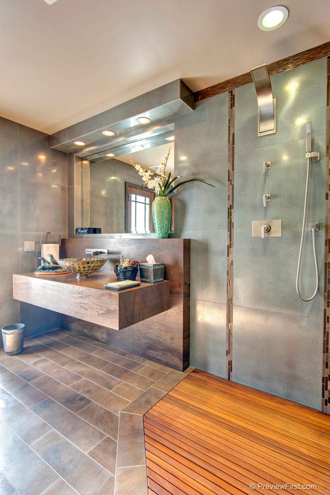 Inspiration for a modern doorless shower remodel in Orange County with a vessel sink