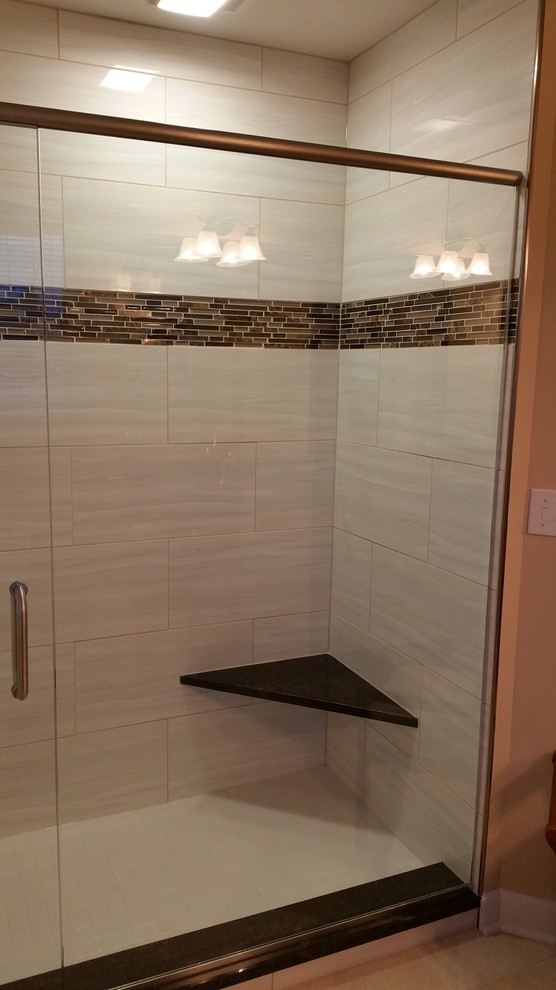 Photo of a large traditional ensuite bathroom in Cleveland with raised-panel cabinets, dark wood cabinets, an alcove shower, a two-piece toilet, white tiles, ceramic tiles, beige walls, ceramic flooring, a submerged sink and granite worktops.