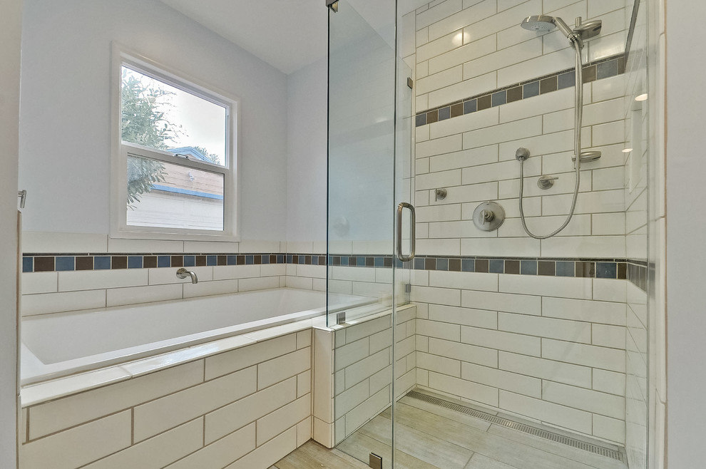 Photo of a large traditional ensuite bathroom in San Francisco with shaker cabinets, dark wood cabinets, a built-in bath, a corner shower, a two-piece toilet, blue tiles, brown tiles, multi-coloured tiles, white tiles, metro tiles, engineered stone worktops, grey walls, porcelain flooring and a trough sink.