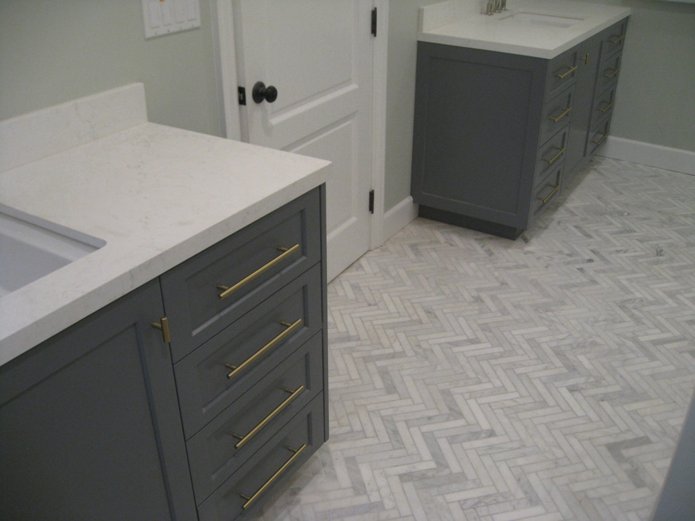 Example of a mid-sized transitional master marble floor and white floor bathroom design in Los Angeles with recessed-panel cabinets, gray cabinets, gray walls, an undermount sink, a hinged shower door and white countertops