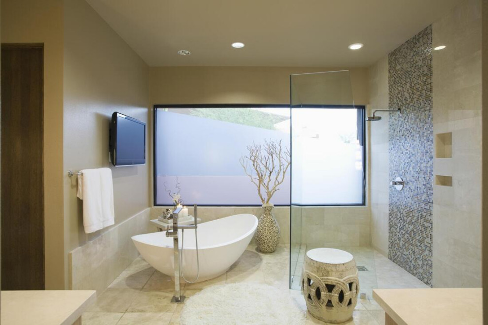 На фото: ванная комната среднего размера в стиле модернизм с стеклянными фасадами, бежевыми фасадами, ванной на ножках, душевой комнатой, бежевой плиткой, каменной плиткой, мраморным полом, душевой кабиной, подвесной раковиной, столешницей из известняка, бежевым полом, открытым душем, бежевой столешницей, тумбой под одну раковину, напольной тумбой, потолком из вагонки и стенами из вагонки