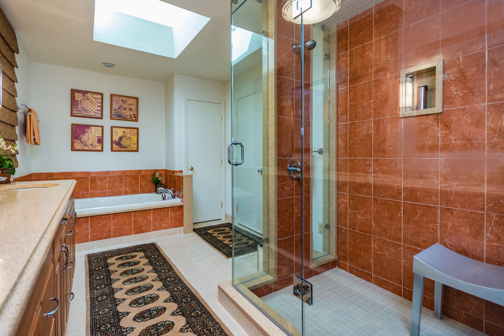 Mid-sized asian master red tile and porcelain tile porcelain tile and white floor bathroom photo in Other with raised-panel cabinets, medium tone wood cabinets, white walls, an undermount sink, quartz countertops, a hinged shower door and beige countertops