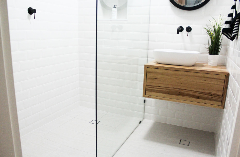 Small shower room bathroom in Perth with freestanding cabinets, distressed cabinets, a walk-in shower, white tiles, ceramic tiles, white walls, porcelain flooring, a vessel sink, wooden worktops, grey floors, an open shower and multi-coloured worktops.