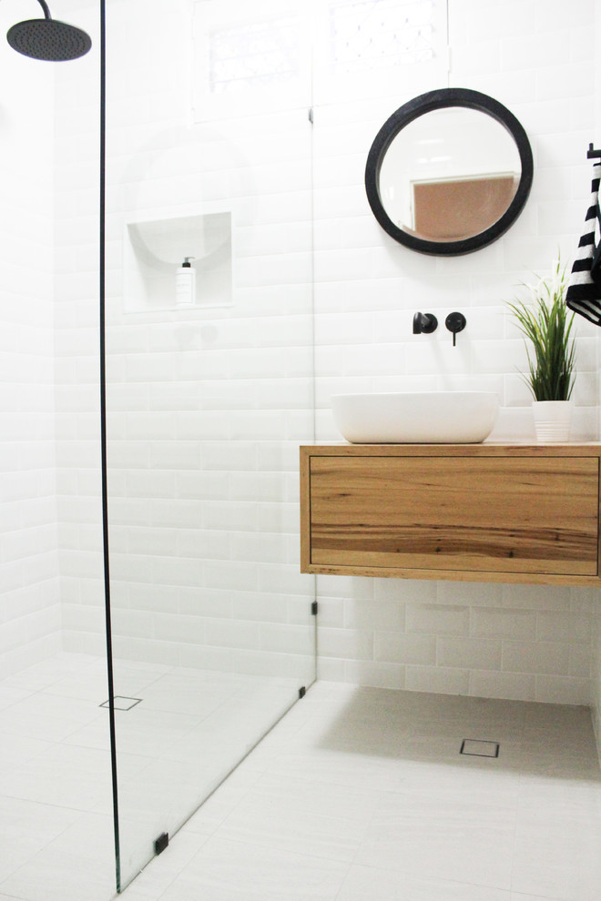 This is an example of a small modern shower room bathroom in Perth with freestanding cabinets, distressed cabinets, a walk-in shower, white tiles, ceramic tiles, white walls, porcelain flooring, a vessel sink, wooden worktops, grey floors, an open shower and multi-coloured worktops.