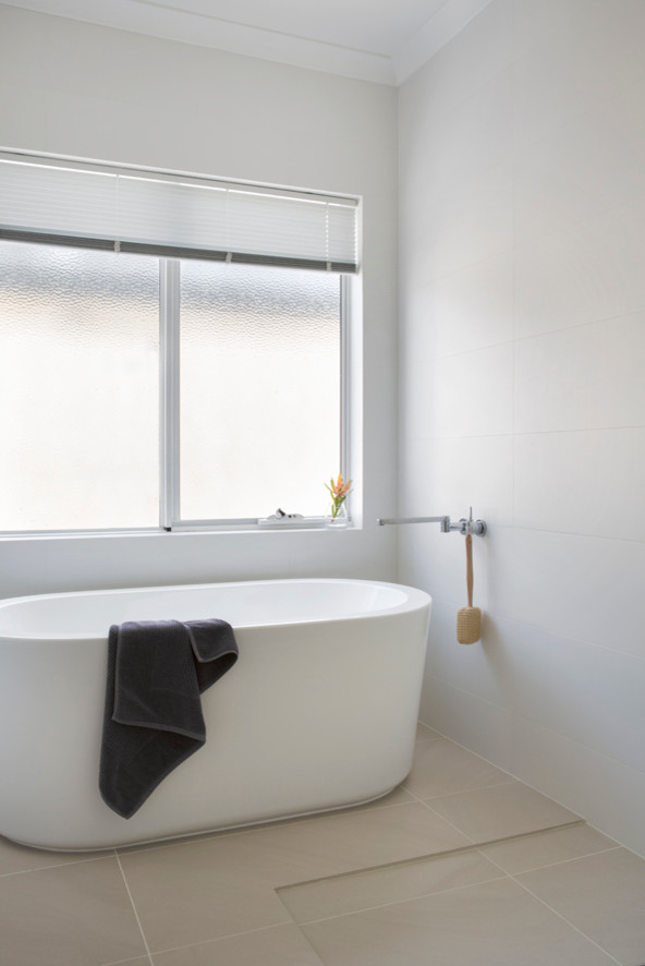 Inspiration for a medium sized contemporary ensuite bathroom in Perth with open cabinets, light wood cabinets, a built-in bath, a walk-in shower, ceramic tiles, white walls, ceramic flooring and solid surface worktops.
