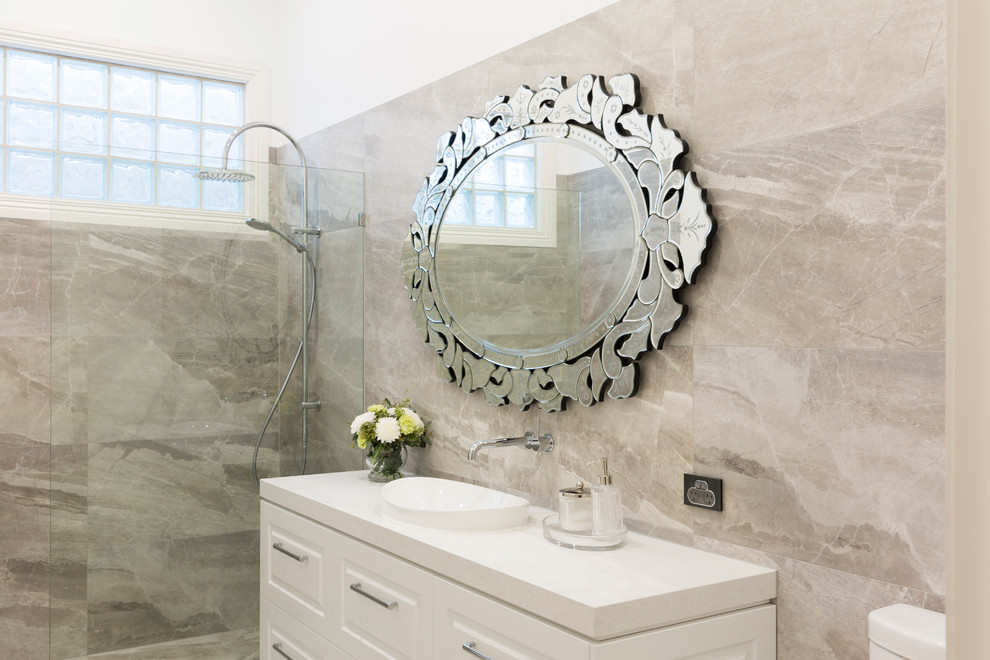 Bathroom - mid-sized traditional master gray tile and porcelain tile porcelain tile and gray floor bathroom idea in Melbourne with shaker cabinets, white cabinets, a one-piece toilet, gray walls, a drop-in sink, quartz countertops and white countertops