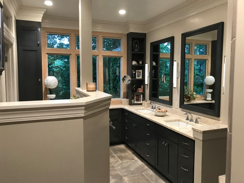 Inspiration for a small contemporary ensuite bathroom in Atlanta with shaker cabinets, grey cabinets, an alcove shower, a two-piece toilet, beige tiles, ceramic tiles, beige walls, ceramic flooring, a submerged sink, limestone worktops, grey floors, a hinged door and beige worktops.