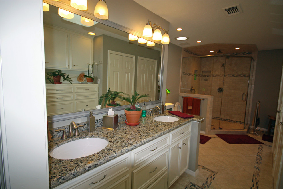 Mid-sized elegant master beige tile and ceramic tile ceramic tile corner shower photo in Houston with an undermount sink, beaded inset cabinets, white cabinets, granite countertops, a one-piece toilet and green walls