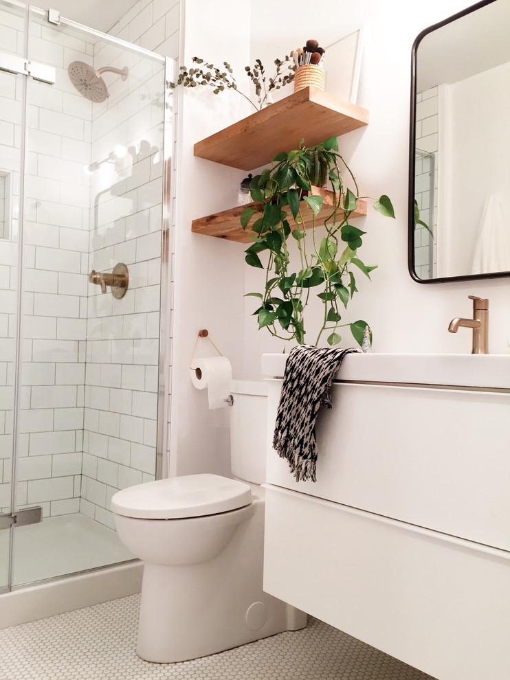Photo of a small scandi shower room bathroom in Vancouver with white cabinets, white tiles, white walls, cement flooring, white floors and a hinged door.