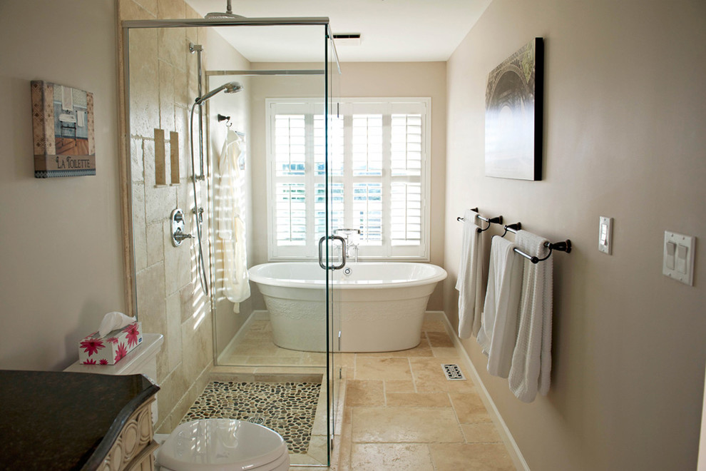 Photo of a medium sized modern bathroom in Other with a freestanding bath, a built-in shower, a one-piece toilet, beige tiles, beige walls, beige floors, a hinged door and black worktops.