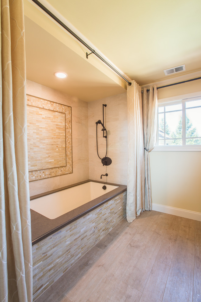 Design ideas for a medium sized traditional bathroom in San Francisco with a submerged sink, freestanding cabinets, distressed cabinets, engineered stone worktops, a submerged bath, a shower/bath combination, a two-piece toilet, glass tiles, yellow walls, porcelain flooring and beige tiles.