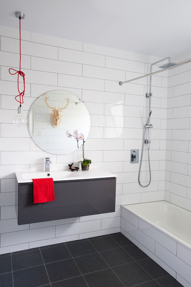 Inspiration for a contemporary white tile and subway tile alcove bathtub remodel in Brisbane with flat-panel cabinets and gray cabinets
