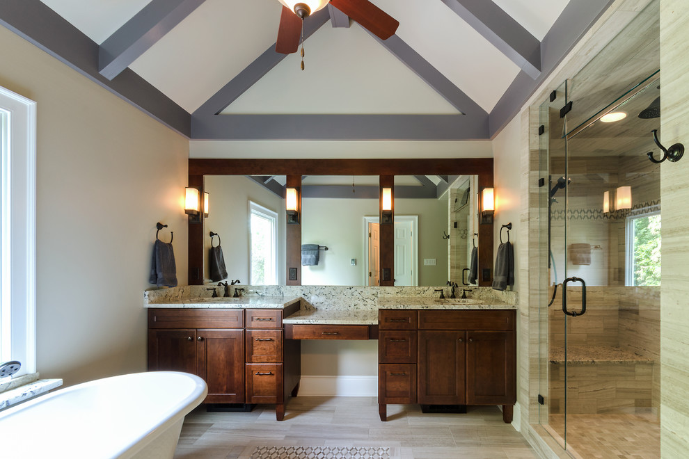 На фото: ванная комната в стиле неоклассика (современная классика) с темными деревянными фасадами, отдельно стоящей ванной и душем в нише