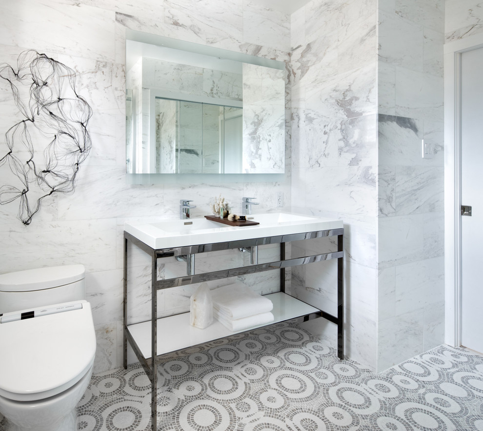 Photo of a contemporary bathroom in Toronto with a console sink, white tiles, stone slabs and mosaic tile flooring.