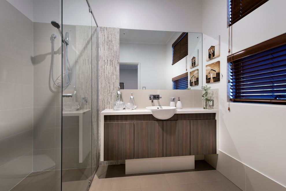 Design ideas for a coastal bathroom in Perth with a vessel sink, flat-panel cabinets, dark wood cabinets, a corner shower, grey tiles and white walls.