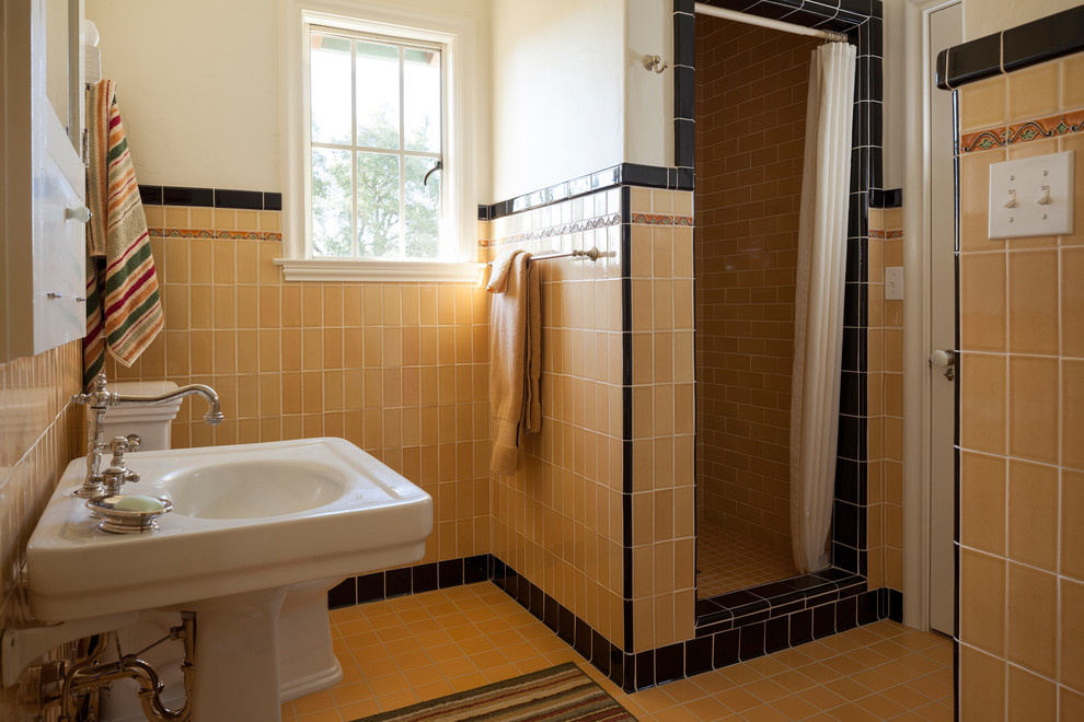 Photo of a contemporary bathroom in San Francisco with a pedestal sink and a shower curtain.