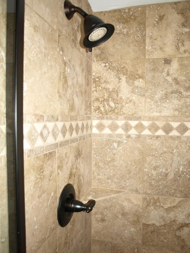 Inspiration for a medium sized traditional bathroom in Denver with tiled worktops, an alcove shower, beige tiles, stone tiles, beige walls and porcelain flooring.