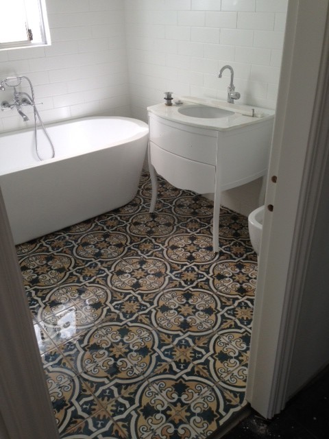 Inspiration for a mediterranean ceramic tile bathroom remodel in Sydney