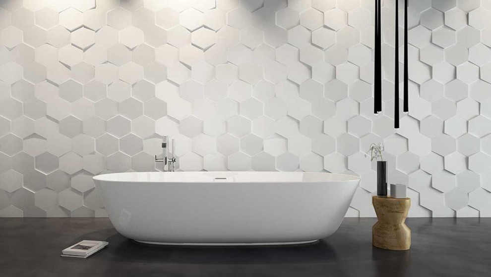 Inspiration för ett funkis en-suite badrum, med ett fristående badkar, vit kakel, porslinskakel, cementgolv och svart golv