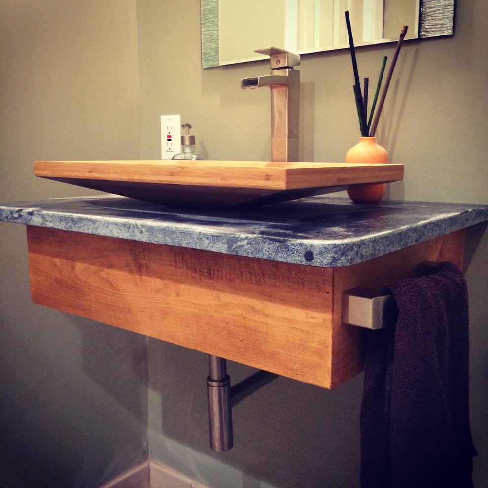 Minimalist bathroom photo in Baltimore with a vessel sink and soapstone countertops